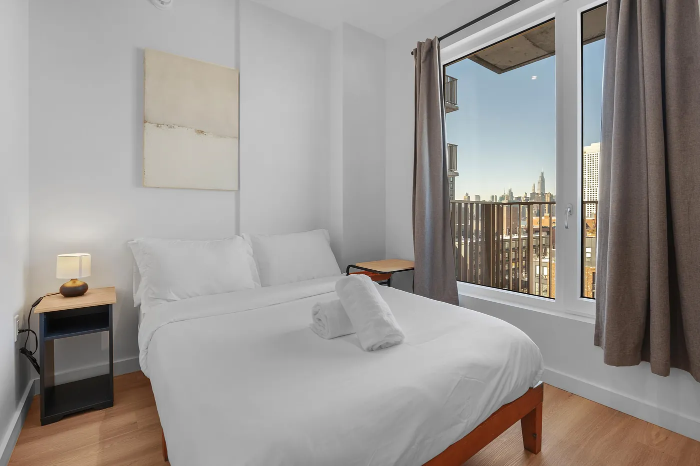 Bright furnished bedroom in a Waypost Brooklyn residence.